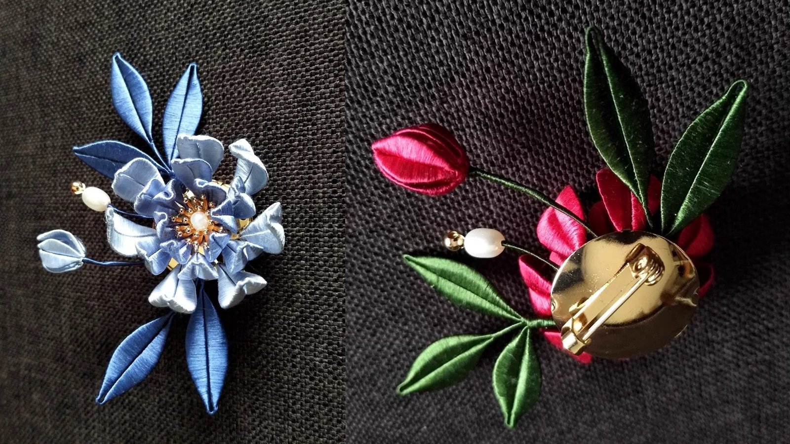Two silk-wrapped flower brooches on dark cloth, one blue and one red, the red one turned to show its gold pin.